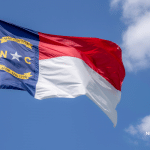 Picture of the North Carolina state flag. Image is being used for a Newswire blog post about the top media outlets in North Carolina.