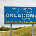 Picture of a "Welcome to Oklahoma" road sign. Image is being used for a Newswire blog post about the top media outlets in Oklahoma.