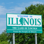 Picture of a "Welcome to Illinois" road sign. Image is being used for a blog post about top media outlets in Illinois.