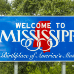 Picture of the "Welcome to Mississippi" highway sign. Image is being used for a Newswire blog post about the top media outlets in Mississippi.